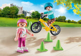 Children With Skates And Bike